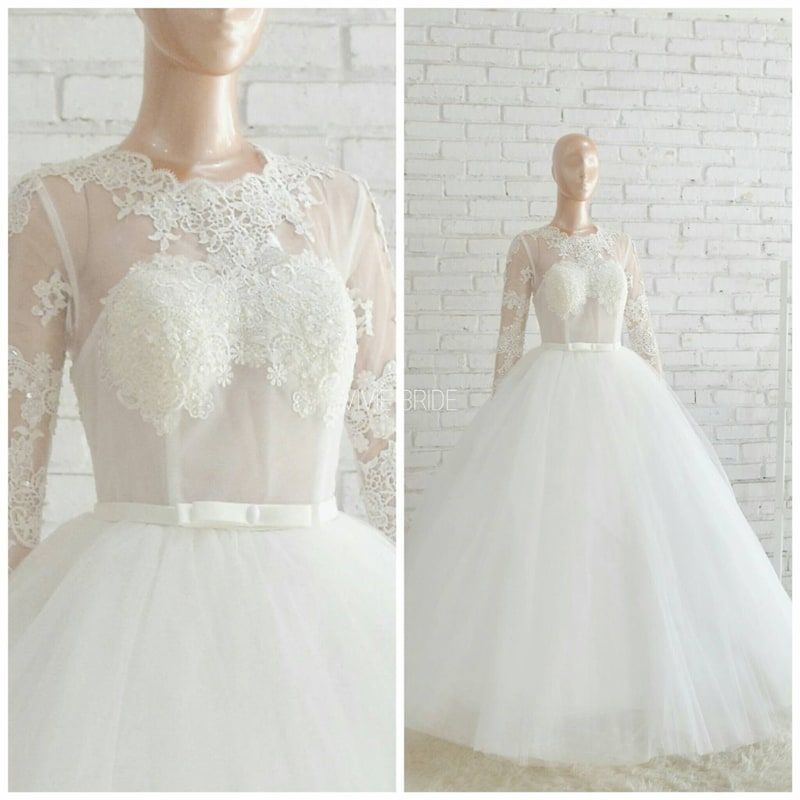 Gaun pengantin ball gown tulle lengan panjang transparan pada manekin